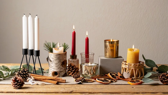 A display of 19 advent candle holder diy ideas, with modern, rustic, and natural candle holders using pinecones, birch, and glass.