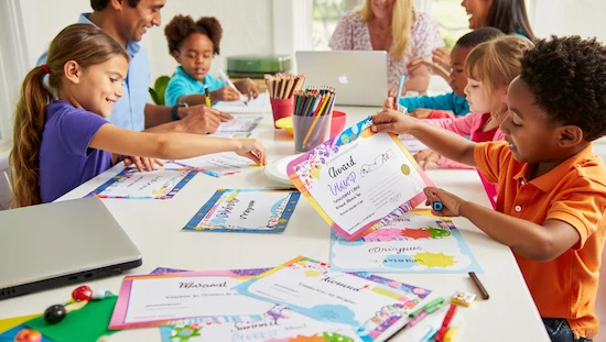Children designing and sharing colorful award diy certificates at a craft table, using markers, pencils, and laptops to create personalized printable awards

