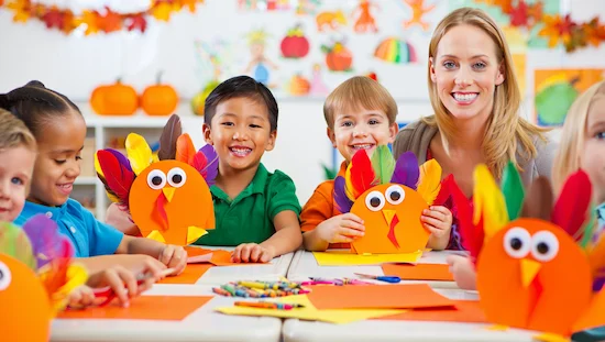 Preschoolers and teacher making festive Thanksgiving turkey crafts in a classroom, preschool crafts for thanksgiving turkey printable.