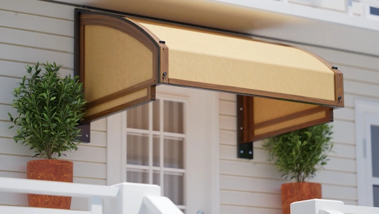 DIY awning over door protects entryway with modern wood frame and beige fabric cover, flanked by potted plants, curb appeal.